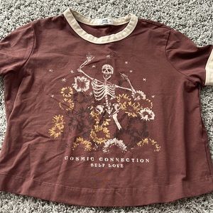 I am selling a a skeleton with flowers “cosmic connection” shirt